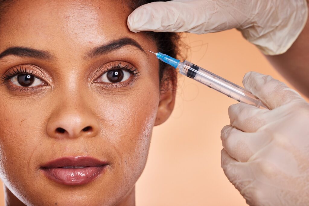 Black woman, botox cosmetics injection and beauty, facial aesthetics and collagen, wellness and ski.